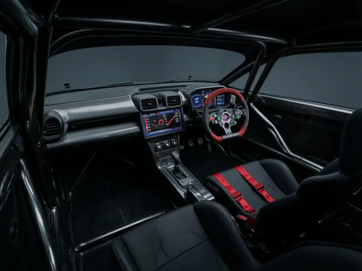 Toyota GR GT3 race cockpit with its carbon-fibre roll cage and multi-function steering wheel